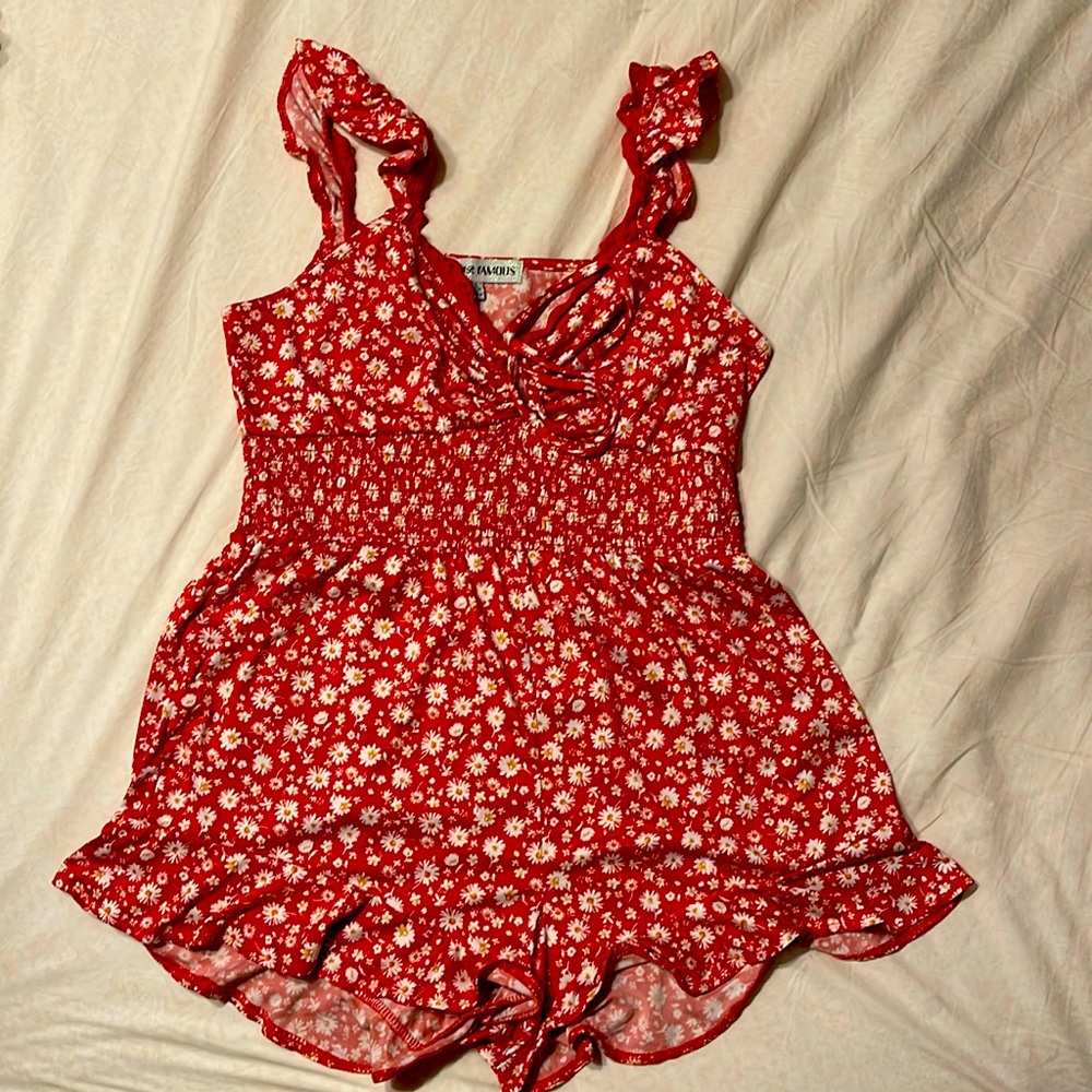 Red romper with white flower pattern